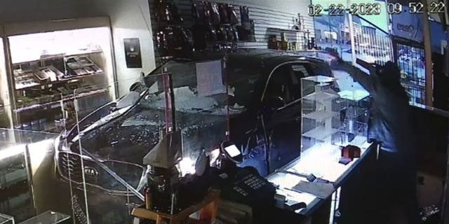 Authorities are searching for a suspect who crashed a stolen Kia through a storefront to steal cartons of cigarettes.