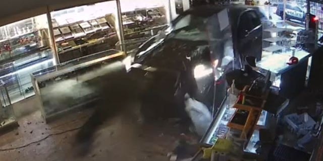 Stolen Kia that crashed into Washington cigar shop located, but deputies say the suspect is still on the run.
