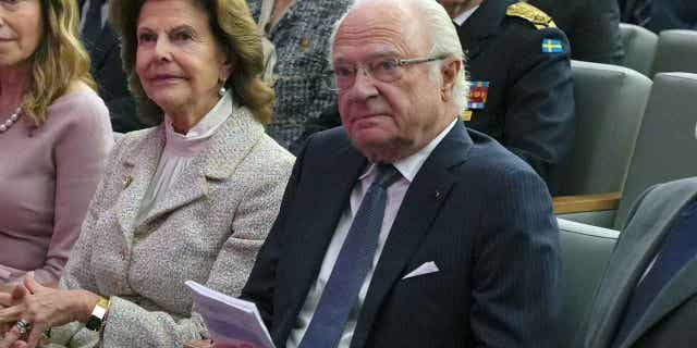 Sweden's King Carl XVI Gustaf, right, sits during a visit to the King Hussein Cancer Center in Amman, Jordan, Nov 16, 2022. King Carl XVI Gustaf is doing well after a heart surgery.