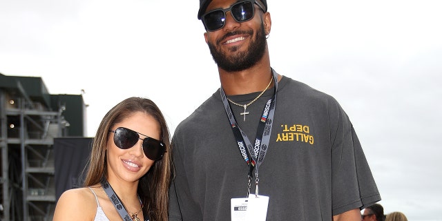 Fred Warner, linebacker for the San Francisco 49ers, and Sydney Warner pose for photos on the red carpet prior to the NASCAR Cup Series Toyota/Save Mart 350 at Sonoma Raceway on June 12, 2022 in Sonoma, California.