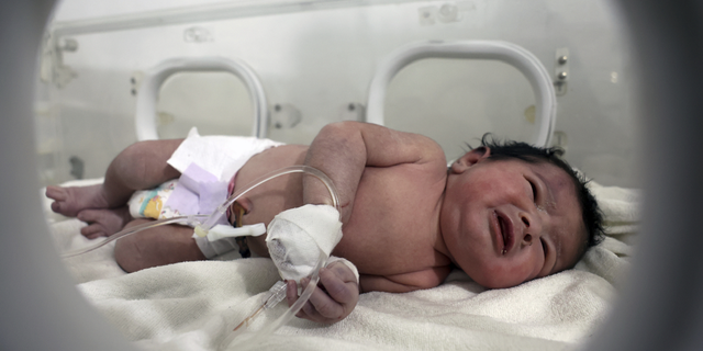 A baby girl who was born under the rubble caused by an earthquake that hit Syria and Turkey receives treatment inside an incubator at a children's hospital in the town of Afrin, Aleppo province, Syria, on Tuesday, Feb. 7.