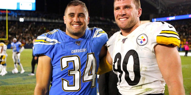 Brothers Derek Watt of the Los Angeles Chargers and TJ Watt of the Pittsburgh Steelers pose after a game at Dignity Health Sports Park on October 13, 2019 in Carson, California.