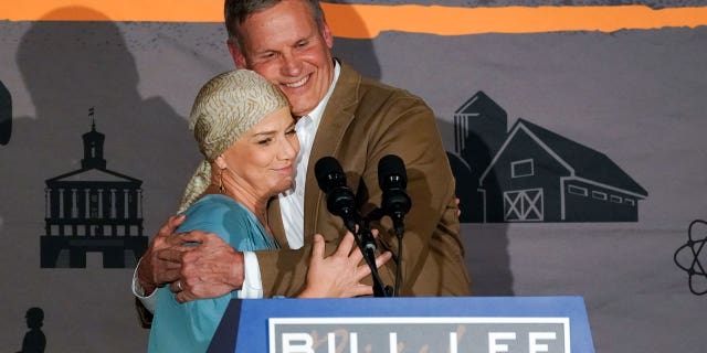 Tennessee Gov. Bill Lee hugs his wife, Maria, as he speaks to supporters after he was declared the winner in his bid for re-election on Nov. 8, 2022, in Franklin, Tennessee.