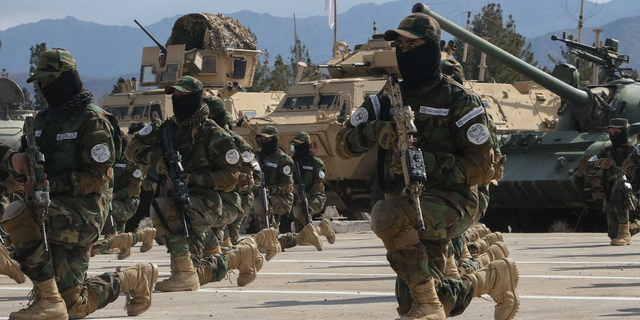 Newly recruited personnel joining Taliban security forces demonstrate their skills during their graduation ceremony in Herat on Feb. 9, 2023.