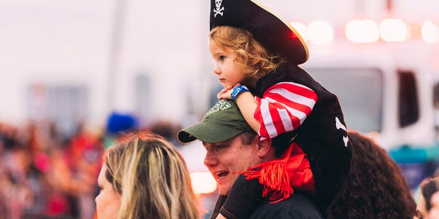 A child attends the Gasparilla parade in Tampa, an annual "pirate invasion" that dates back to 1904 and has become one of the largest parades in the nation.