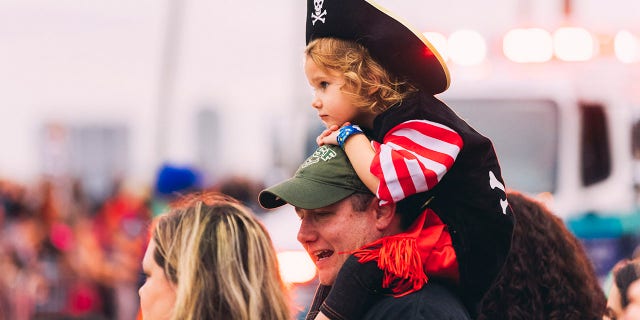 A child attends the Gasparilla parade in Tampa, an annual "pirate invasion" that dates back to 1904 and has become one of the largest parades in the nation. 