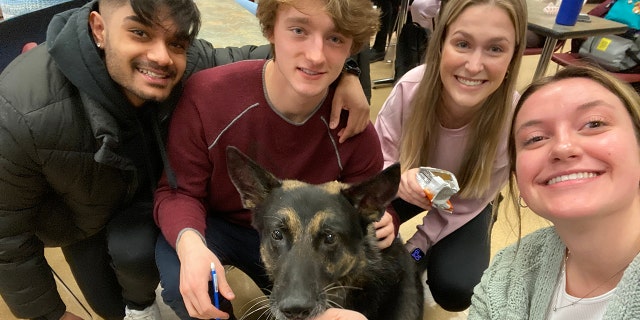 Students in assistant professor Simone Peinkofer's class took part in a scavenger hunt that included snapping a photo with Officer Tole.