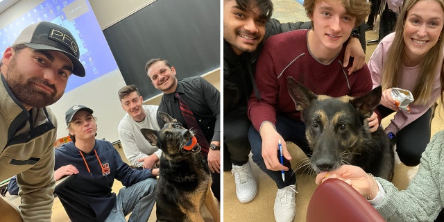 Michigan State University students pose with retired K-9 Officer Tole shortly after a gunman opened fire on campus.