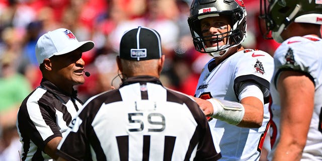 Tom Brady of the Buccaneers discusses a play with referees during the Atlanta Falcons game at Raymond James Stadium on Oct. 9, 2022, in Tampa, Florida.