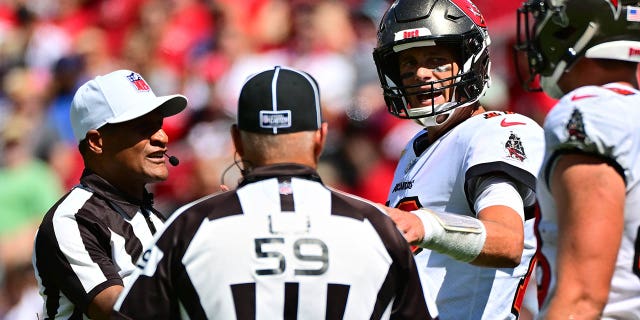 Tom Brady of the Buccaneers discusses a play with referees during the Atlanta Falcons game at Raymond James Stadium on Oct. 9, 2022, in Tampa, Florida.