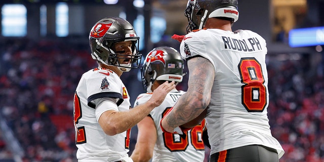 Kyle Rudolph (8) of the Tampa Bay Buccaneers celebrates his touchdown catch with Tom Brady (12) during the first quarter against the Atlanta Falcons at Mercedes-Benz Stadium Jan. 8, 2023, in Atlanta.