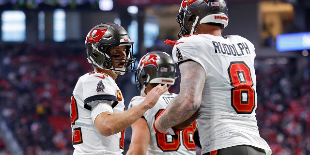 Kyle Rudolph (8) of the Tampa Bay Buccaneers celebrates his touchdown catch with Tom Brady (12) during the first quarter against the Atlanta Falcons at Mercedes-Benz Stadium Jan. 8, 2023, in Atlanta.