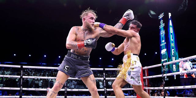 Tommy Fury, right, trades blows with Jake Paul during a cruiserweight title fight at Diriyah Arena on February 26, 2023 in Riyadh, Saudi Arabia.