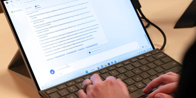 Microsoft employee Alex Buscher demonstrates a search feature integration of Microsoft Bing search engine and Edge browser with OpenAI on Feb. 7, 2023, in Redmond.