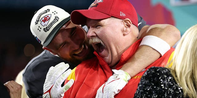 Travis Kelce #87 and head coach Andy Reid of the Kansas City Chiefs celebrate after defeating the Philadelphia Eagles 38-35 in Super Bowl LVII at State Farm Stadium on February 12, 2023 in Glendale, Arizona. 