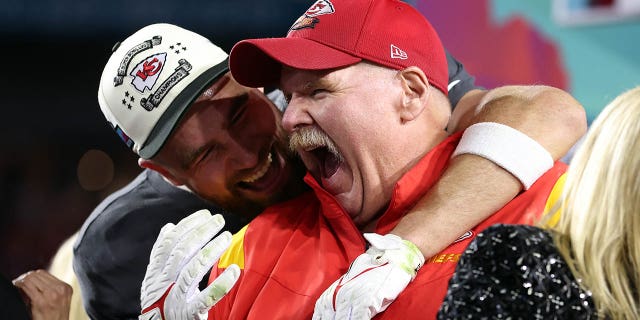 Travis Kelce #87 and head coach Andy Reid of the Kansas City Chiefs celebrate after defeating the Philadelphia Eagles 38-35 in Super Bowl LVII at State Farm Stadium on February 12, 2023 in Glendale, Arizona. 