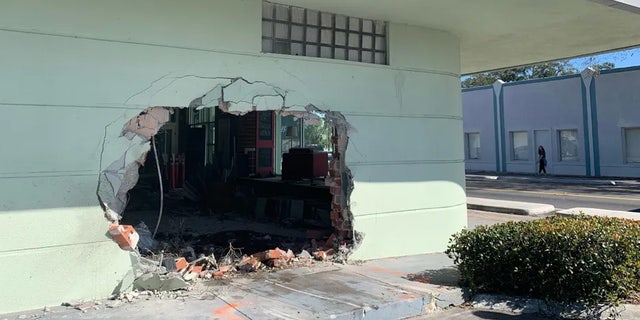 Florida pickup truck crashes into shopping center, one dead