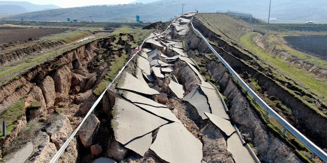 Cracks are seen along the road near the town of Pazarcik in southern Turkey, on Sunday, Feb. 12, following last week's earthquake.