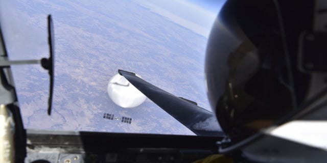 A pilot looks down upon a suspected Chinese spy balloon on Feb. 3, 2023.