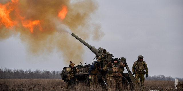 Ukrainian artillery teams fire toward Russian troop positions in Bakhmut, Ukraine.