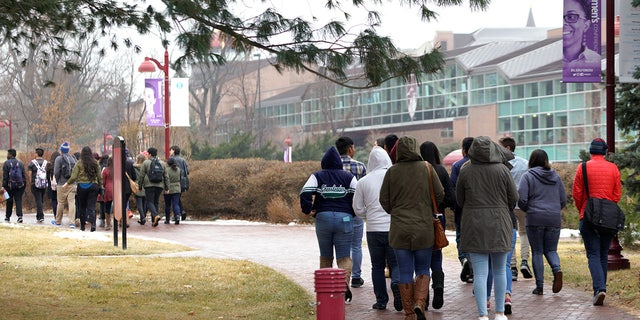 Prospective students take a tour at the University of Denver in Denver, Colorado.