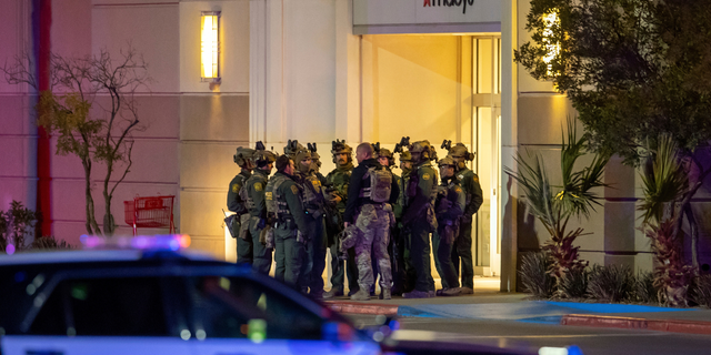 Police officers gather at the entrance to a mall on Wednesday, February 15, 2023, in El Paso, Texas.  Police say a shooting at the Cielo Vista Mall left one dead and three others injured.  One person was taken into custody, El Paso police spokesman Sgt.  Robert Gomez said. 