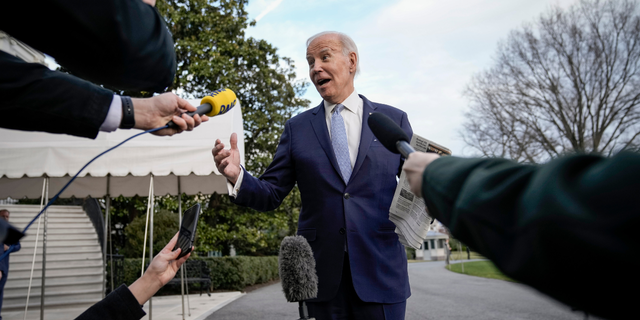 President Joe Biden stops to speak to reporters on the South Lawn of the White House, Feb. 24, 2023.