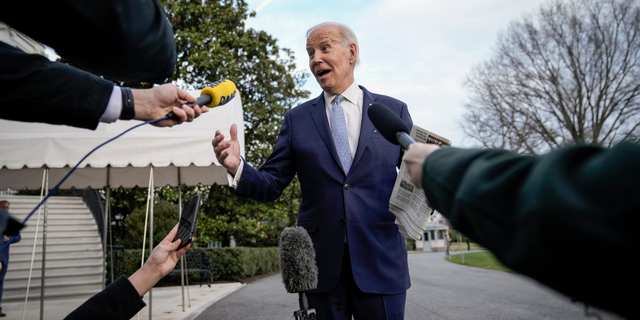 President Joe Biden stops to speak to reporters on the South Lawn of the White House, Feb. 24, 2023.