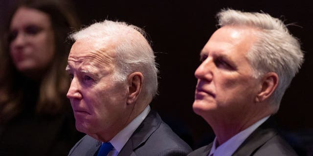 President Joe Biden (L) sits next to Speaker of the House Kevin McCarthy (R-CA) during the National Prayer Breakfast at the U.S. Capitol on February 02, 2023, in Washington, DC.
