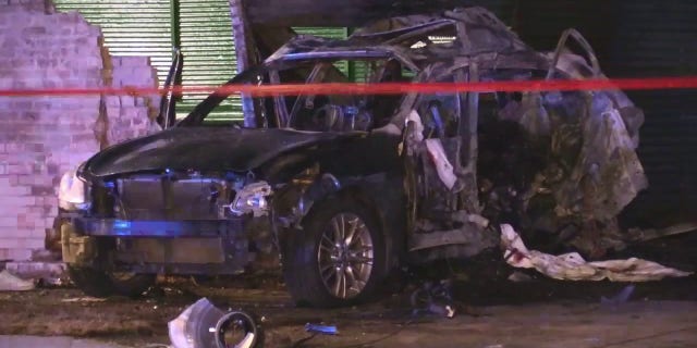 A car caught on fire after police say it crashed into a building while the driver was drag racing in Chicago over the weekend.