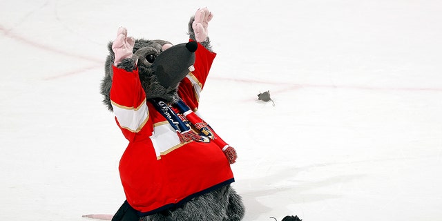 Florida Panthers mascot Victor E. Rutt gathers his rat friends for a quick prayer of thanks for their 9-2 victory over the Columbus Blue Jackets at FLA Live Arena on January 15, 2022 in Sunrise, Florida.