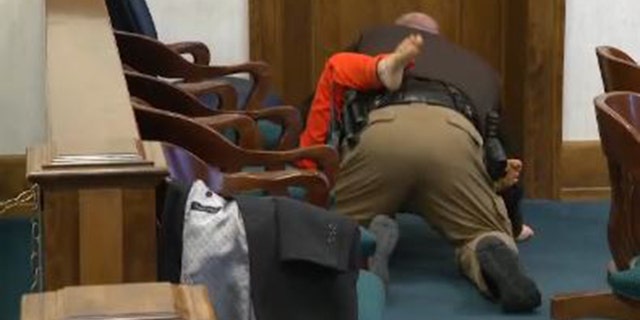 Schabusiness was wrestled to the courtroom floor by a deputy after the attack.