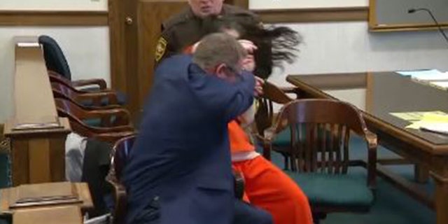 Taylor Schabusiness, 25, attacks her attorney, Quinn Jolly, in a courtroom on Feb. 14, 2023.