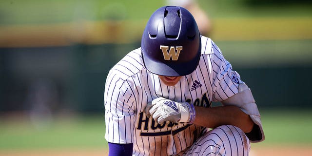 Washington Huskies outfielder AJ Guerrero waits at first base during a PAC-12 baseball tournament game against the UCLA Bruins May 26, 2022, at Scottsdale Stadium in Scottsdale, Ariz.