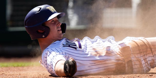 Washington Huskies infielder Will Simpson looks to the umpire who calls him out during a PAC-12 baseball tournament game between the Washington Huskies and the UCLA Bruins May 26, 2022, at Scottsdale Stadium in Scottsdale, Ariz.