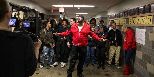 Will Keeps records a music video with students in a hallway on the Des Moines Public School central campus on January 29, 2016 in Des Moines, Iowa. Keeps says he plans to stay "everything in it" about helping children after he was shot in a shootout that killed two students.