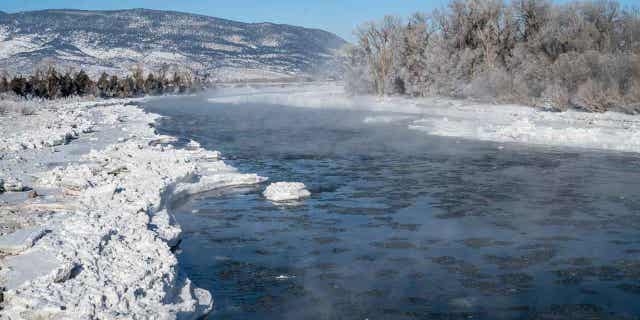 Mist rises above ice floes on the Yellowstone River after a night of -29 degree temperatures on Dec. 2, 2022, in Paradise Valley, Montana. Northern United States is expecting a winter storm in the coming days.
