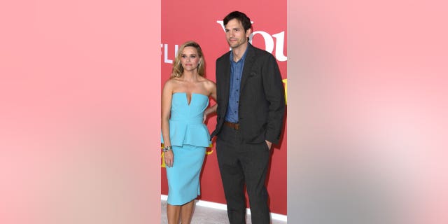 Ashton Kutcher addressed the "awkward" photos of him and Reese Witherspoon in a new interview.