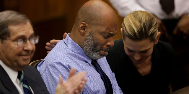 Lamar Johnson and his attorneys react on Tuesday, Feb. 14, 2023, after St. Louis Circuit Judge David Mason vacated his murder conviction.