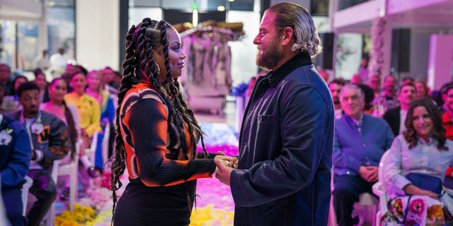 Lauren London and Jonah Hill in the wedding scene for "You People" on Netflix.