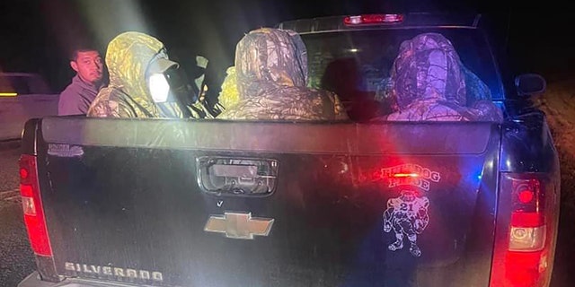 Deputies found 13 illegal immigrants dressed in camouflage in a pickup truck.