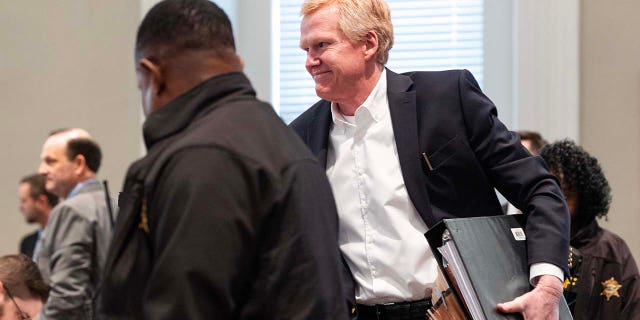 Alex Murdaugh smiles to his family in the audience as he returns for the afternoon session of his trial for murder at the Colleton County Courthouse on Tuesday, February 7, 2023.