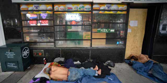 Homeless people sleep on Marietta Street in Atlanta, on June 5, 2020. On Feb. 13, 2023, a Georgia Senate committee passed a bill that would say cities and counties have to enforce bans on public camping or sleeping.