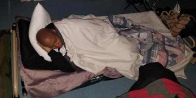 New York City Mayor Eric Adams sleeps on a cot at the Brooklyn Cruise Terminal.