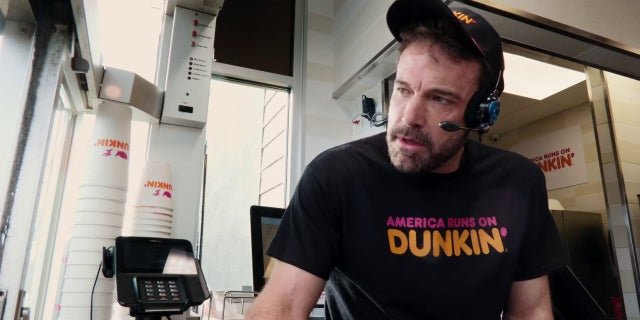 Ben Affleck works the drive-thru in Dunkin's Super Bowl ad.