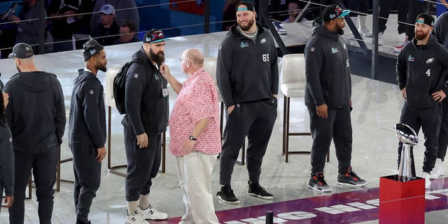 Head coach Andy Reid of the Kansas City Chiefs pulls the beard of Jason Kelce of the Philadelphia Eagles during opening night of Super Bowl LVII presented by Fast Twitch at the Footprint Center on February 6, 2023 in Phoenix, Arizona.