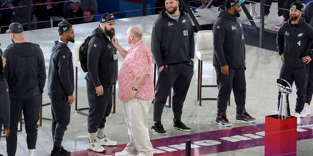 Kansas City Chiefs head coach Andy Reed tugs on Philadelphia Eagles No. 62 Jason Kelsey's beard during the opening of Super Bowl LVII presented by Fast Twitch at the Footprint Center on February 6, 2023 in Phoenix, Arizona.