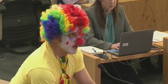Alex Strenger, a resident of Austin, Texas, attends the city council meeting on Thursday, Feb. 9, 2023, dressed as a clown to nominate himself to be CEO of Austin Energy.