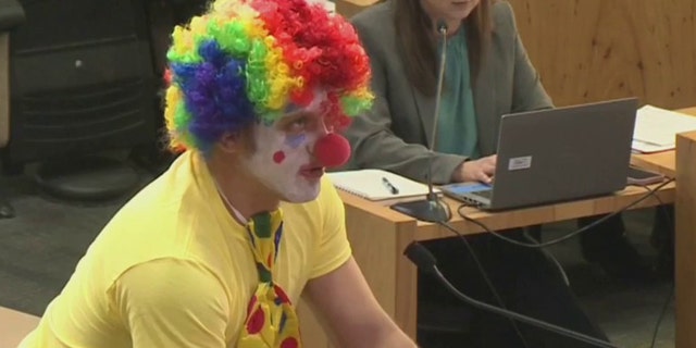 Alex Strenger, a resident of Austin, Texas, attends the city council meeting on Thursday, Feb. 9, 2023, dressed as a clown to nominate himself to be CEO of Austin Energy.