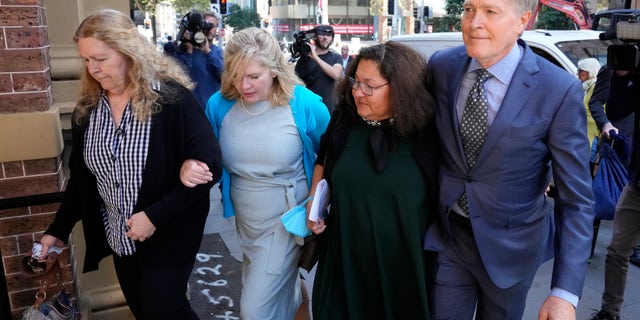 Steve Johnson, right, arrives with his family at the Supreme Court in Sydney on May 2, 2022, for a sentencing hearing in the murder of their brother, Scott Johnson. An Australian pleaded guilty on Feb. 23, 2023, to the manslaughter of Scott Johnson.